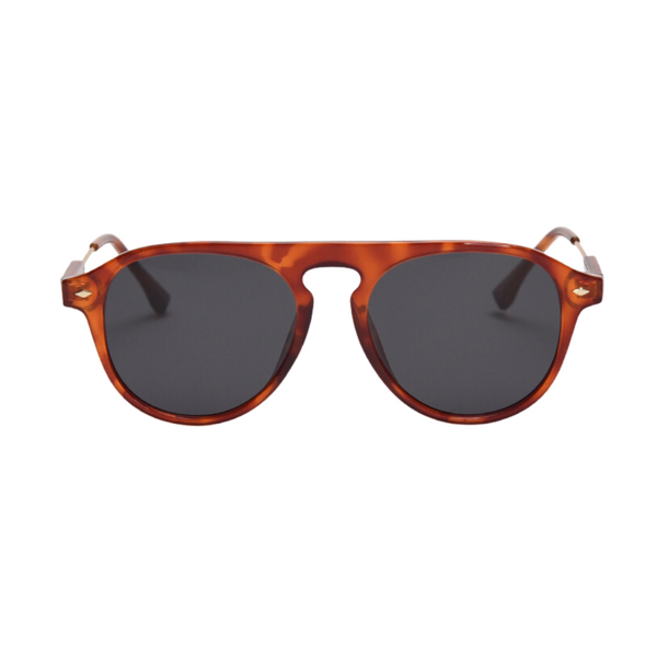 Pink Baby The Riley tort sunglasses with rounded frames and dark lenses, stylish eyewear for sun protection.