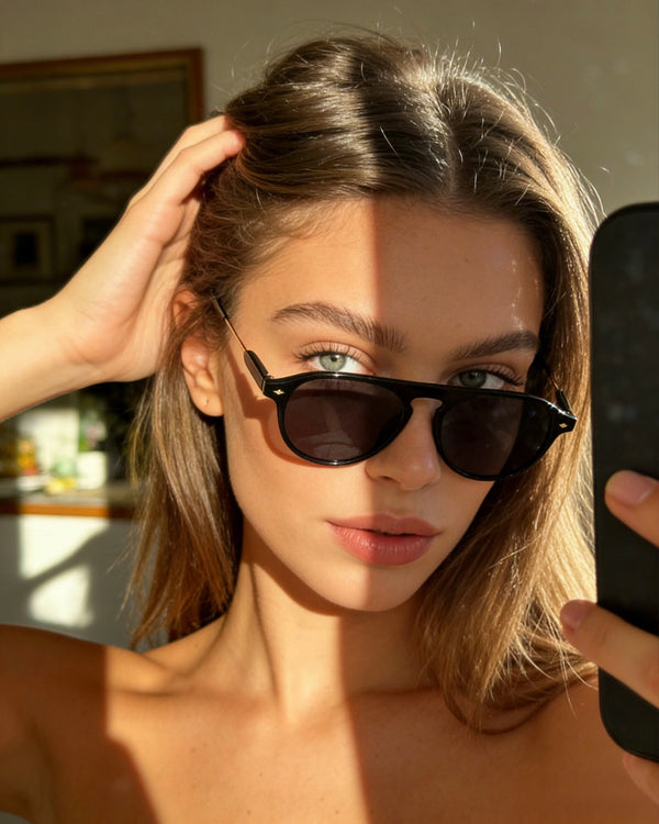 Pink Baby The Riley black sunglasses with stylish square frames and dark lenses, perfect for sun protection and fashion.