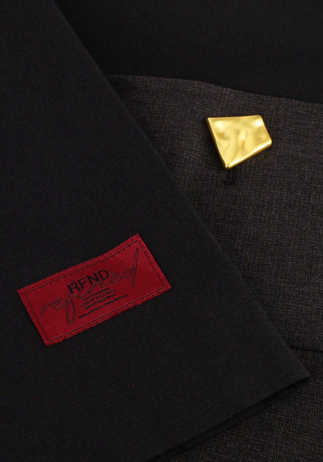 Charcoal black Marcella Gold-Button tailored mini dress by Pink Baby, featuring a fitted silhouette and gold button details.