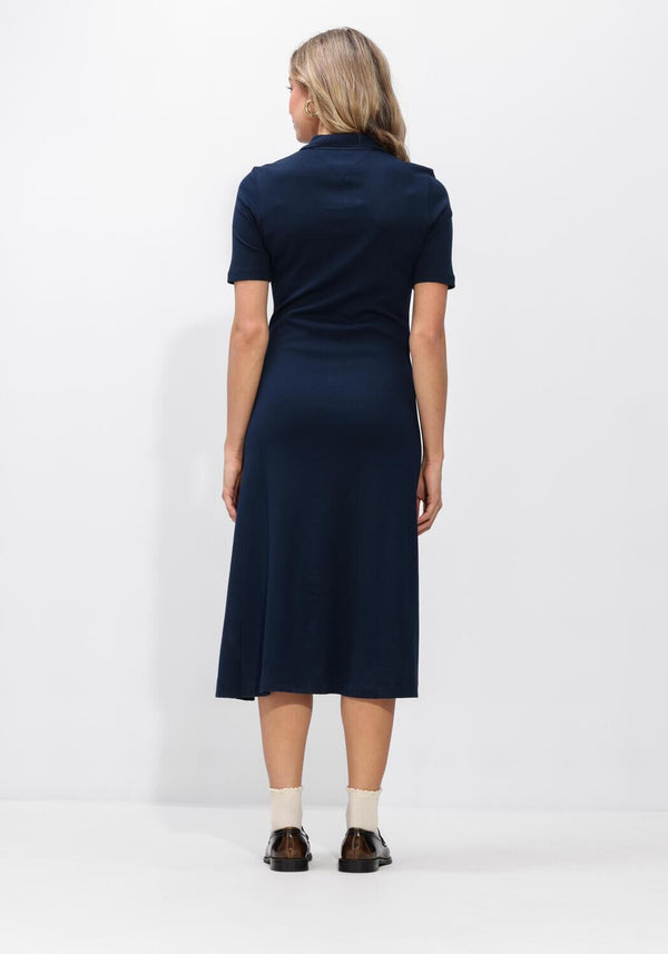 Pink Baby Lucia button-front collared navy midi dress hanging on a display with buttons and collar details.