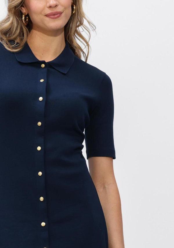 Pink Baby Lucia button-front collared navy midi dress displayed on a hanger with a close-up of the front detail.