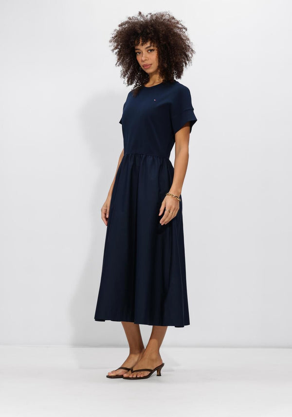 Pink Baby Allegra gathered midi dress in midnight navy with a fitted bodice and flowing skirt, perfect for elegant occasions.