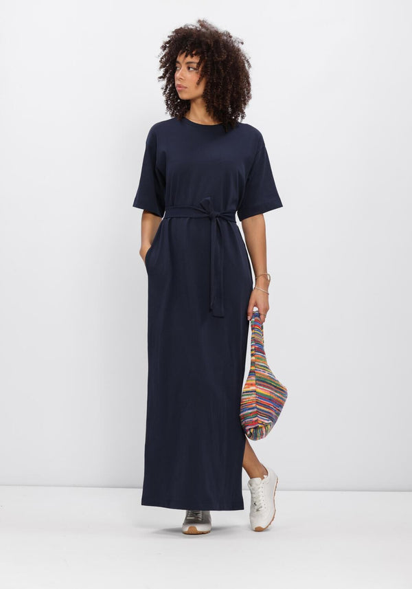 Pink Baby Noela belted navy maxi T-shirt dress displayed on a hanger, showcasing its relaxed fit and stylish design.