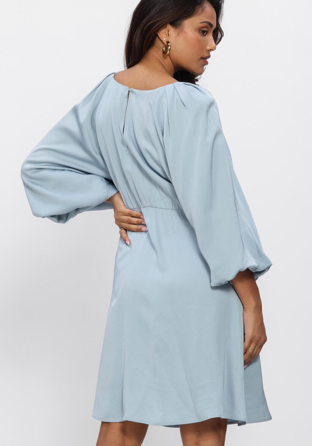 Dusty blue Evelina balloon-sleeve mini dress by Pink Baby, featuring draped fabric and stylish silhouette.