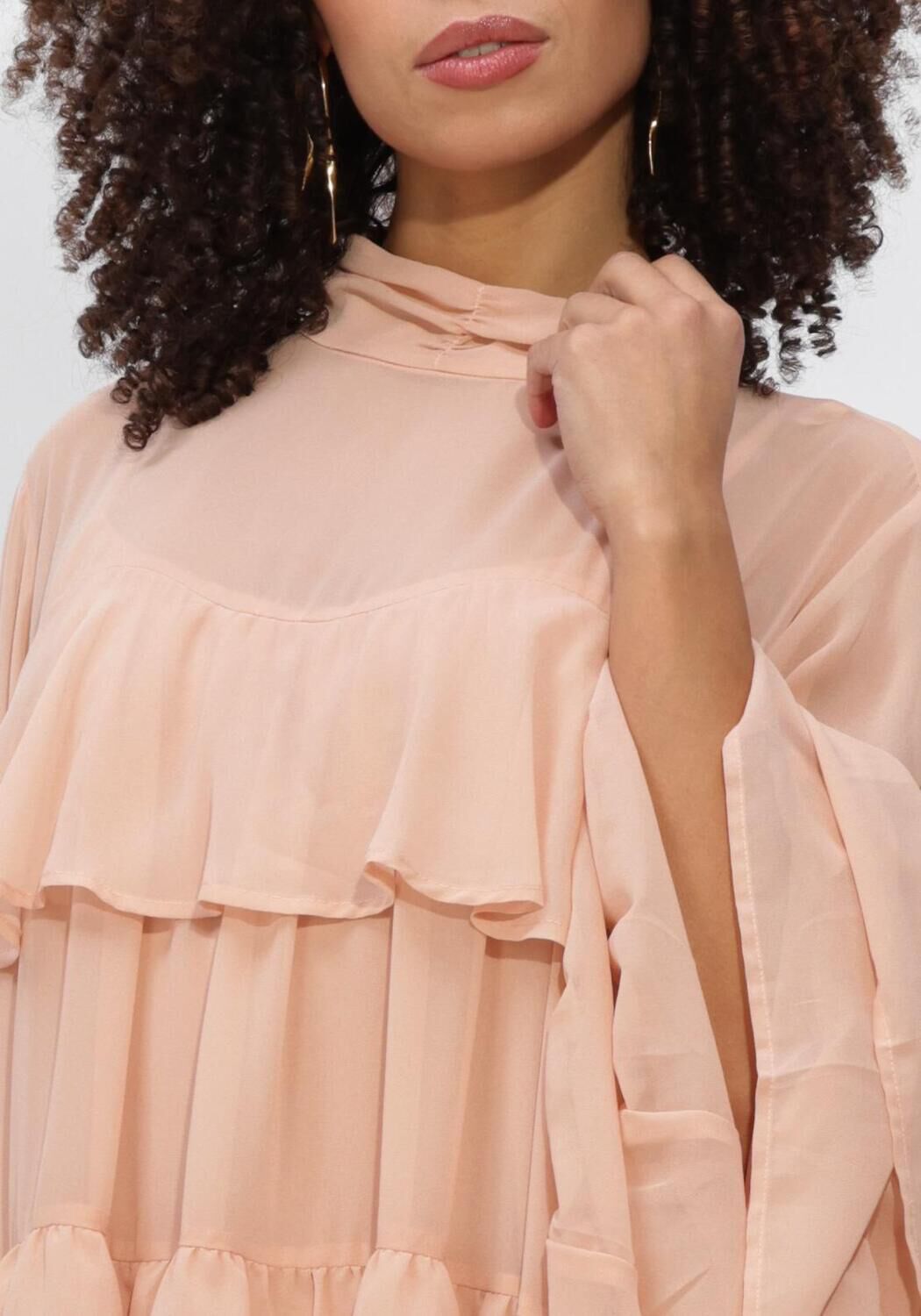 Pink Baby Celeste tiered ruffle mini dress in blush pink, featuring layered ruffles and a stylish, feminine design.