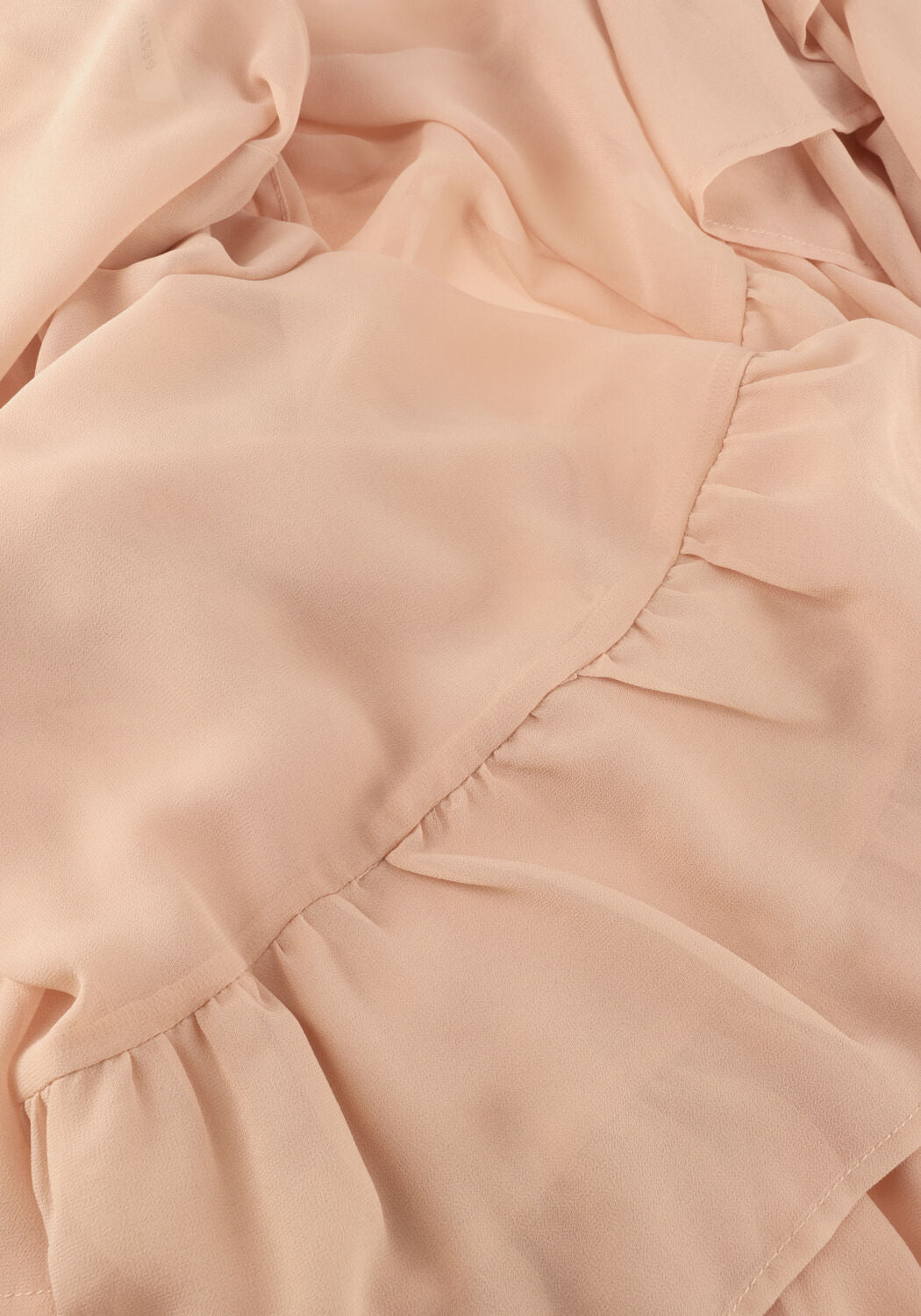Pink Baby Celeste tiered ruffle mini dress in blush pink, featuring layered ruffles and a soft, feminine design.