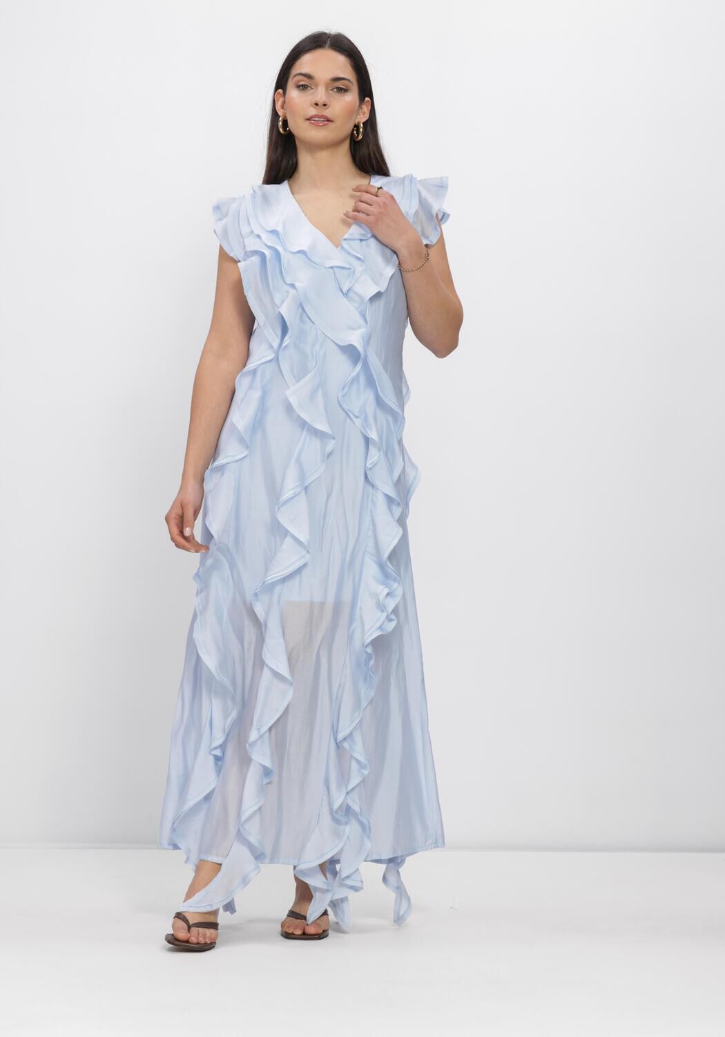 Pink Baby Diana ruffled maxi dress in soft blue with flowing fabric and ruffle details, perfect for elegant summer occasions.
