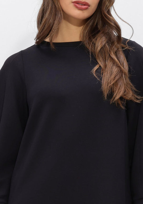 Black Helena long-sleeve shift dress by Pink Baby, featuring a simple, elegant design and comfortable fit.
