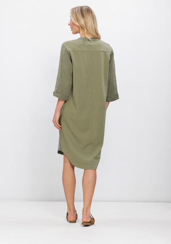 Olive green Sabrina linen midi tunic dress by Pink Baby, featuring a relaxed fit and casual elegance, shown on a model.
