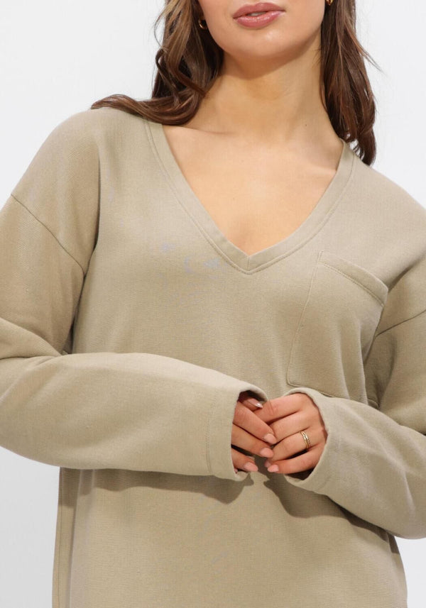 Pink Baby Elaine relaxed V-neck midi dress in sand beige, featuring a flowing silhouette and casual elegant style.