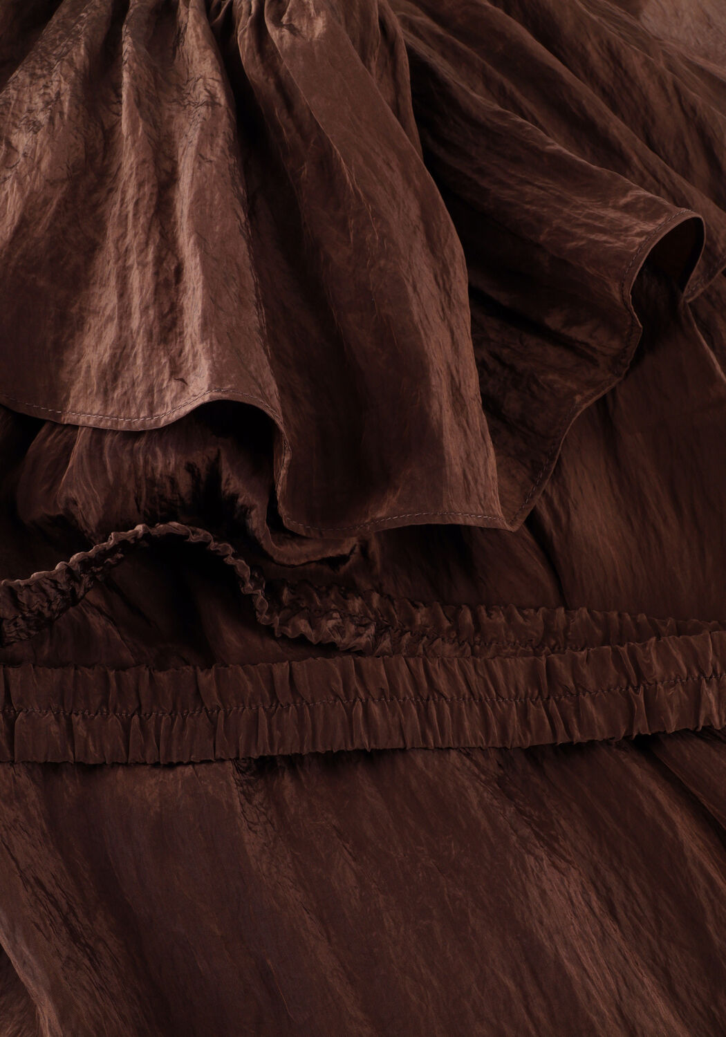Pink Baby Rosalyn off-shoulder ruffle mini dress in chocolate brown, featuring a stylish off-shoulder design and ruffle details.