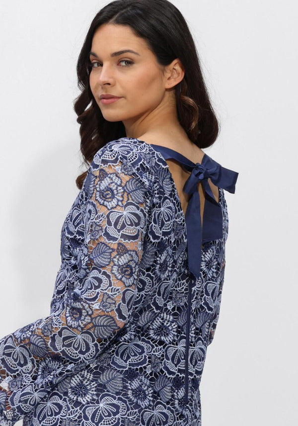 Navy blue Rosa Lace Floral Dress with tie back detail by Pink Baby, featuring intricate lace and floral pattern for girls.