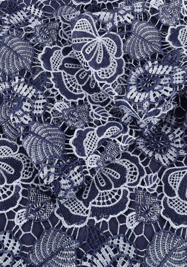 Navy blue Rosa Lace floral dress with tie back detail by Pink Baby, featuring elegant lace and floral patterns.