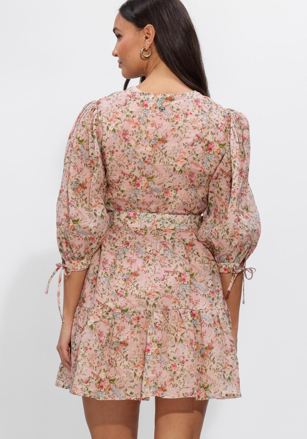 Pink Baby Eloisa belted floral mini dress in blush pink, showing a lightweight, sleeveless design with a waist belt.