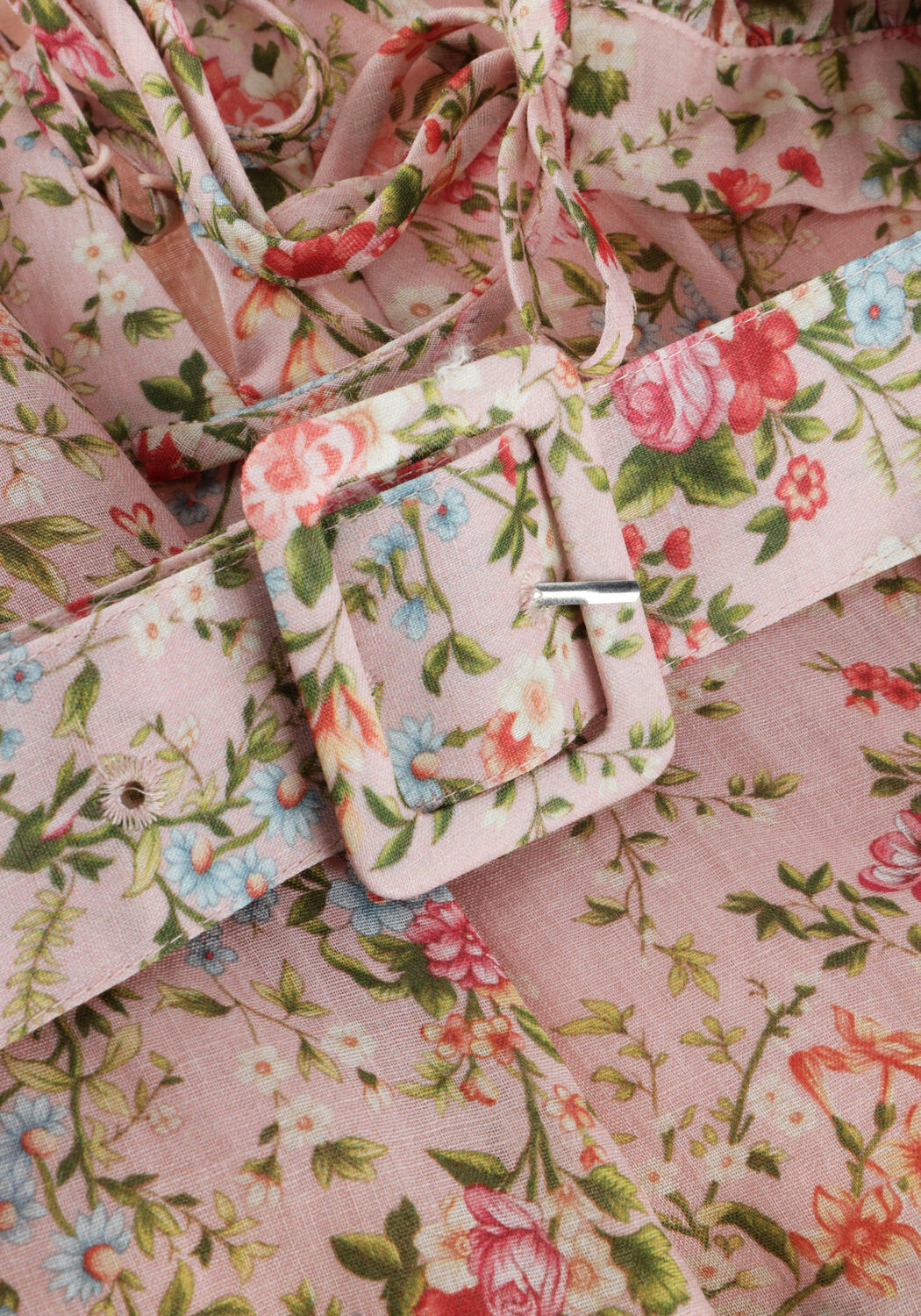 Pink Baby Eloisa belted floral mini dress in blush pink, featuring a flowy design and floral pattern.