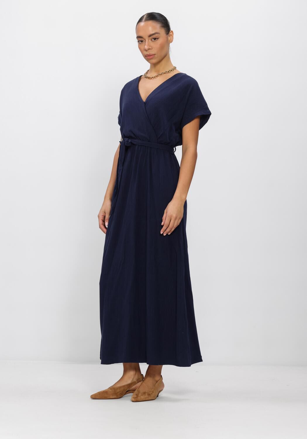 Pink Baby Rosalia belted wrap maxi dress in navy, featuring a flowy fabric and stylish waist tie for elegant evening wear.
