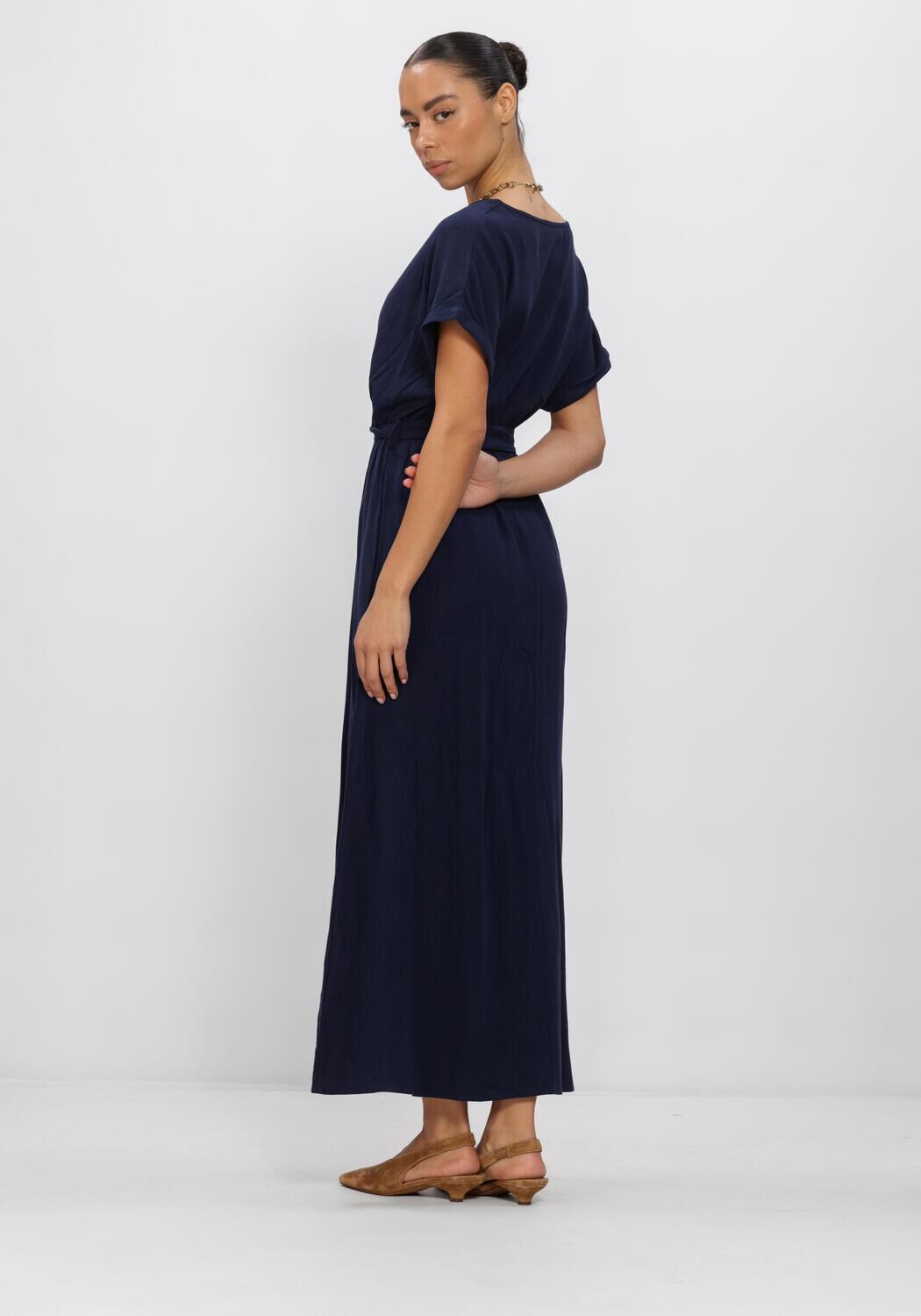 Navy Rosalia belted wrap maxi dress by Pink Baby, featuring a flowing silhouette and elegant waist sash.