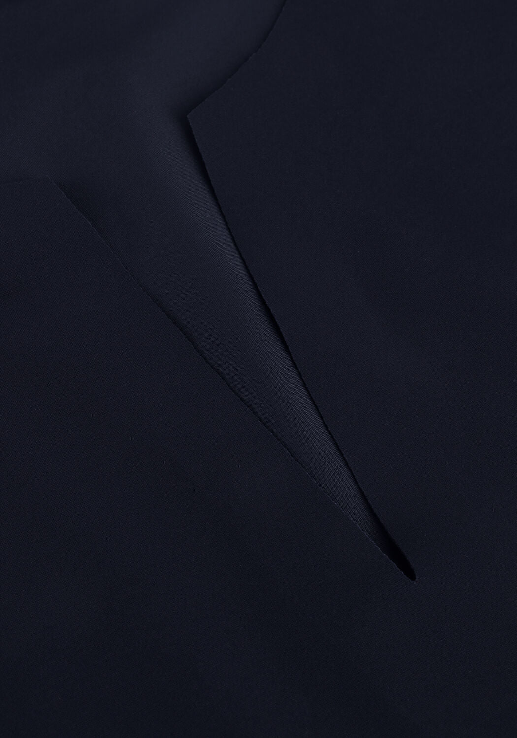 Pink Baby Serena belted notch-neck navy midi dress displayed on a hanger, showcasing its elegant design and midi length.