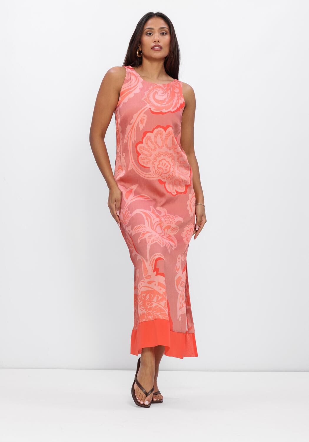 Pink Baby Rosalind floral print maxi dress in coral pink, featuring a flowing design and vibrant floral pattern.