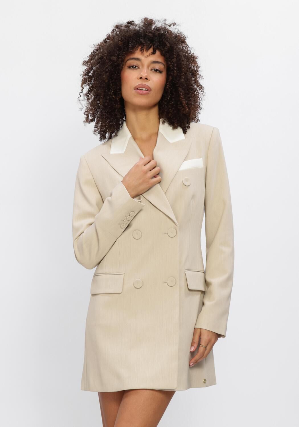 Pink Baby beige Isabel tailored double-breasted blazer mini dress displayed on a hanger, showcasing its structured design and classic style.