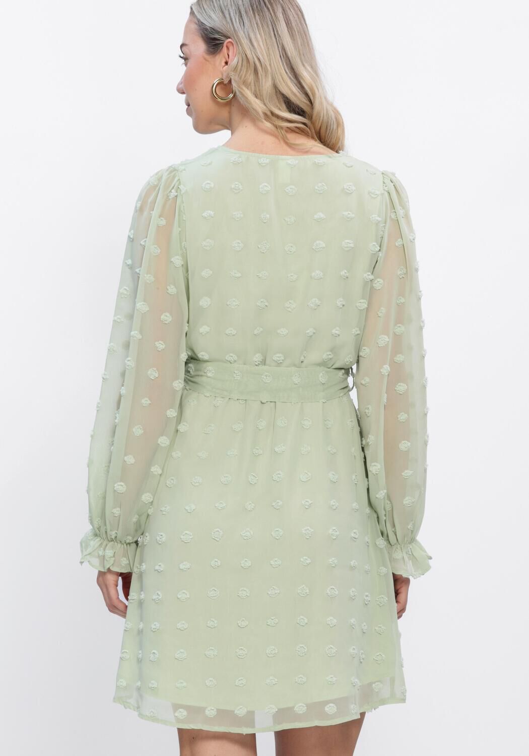 Pink Baby Elodia Dobby Wrap Mini Dress in sage green, featuring a stylish wrap design and short sleeves, perfect for casual wear.