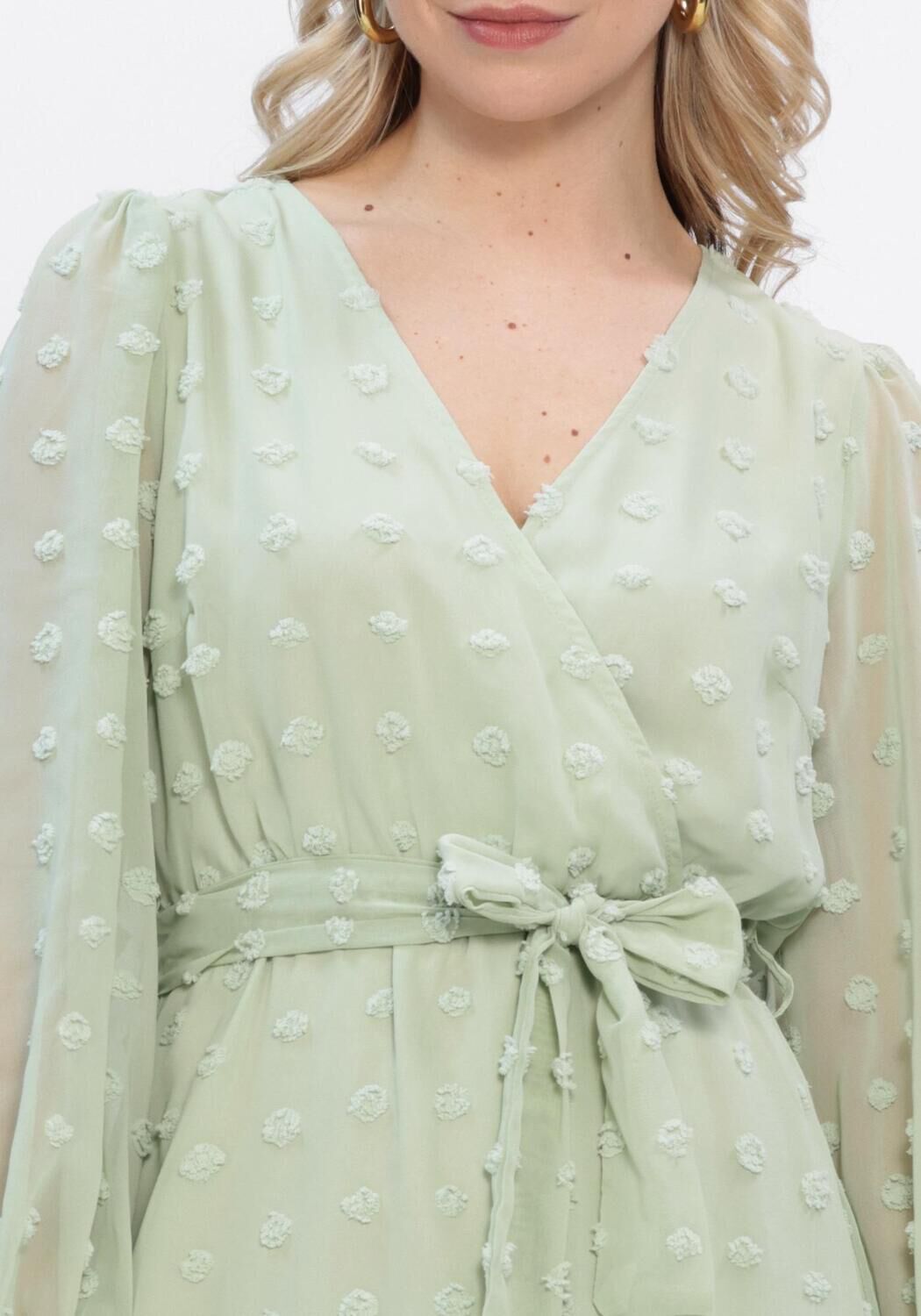 Pink Baby Elodia Dobby Wrap Mini Dress in sage green, featuring a stylish wrap design and short sleeves.