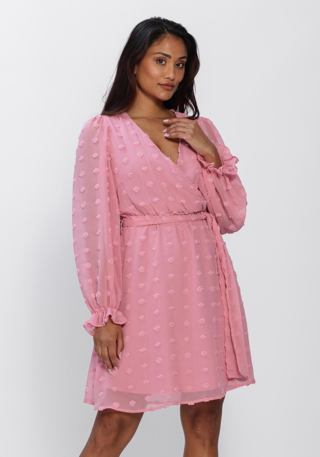 Pink Baby Rona Dobby Wrap Mini Dress in blush pink, featuring a stylish wrap design and short sleeves, perfect for casual wear.