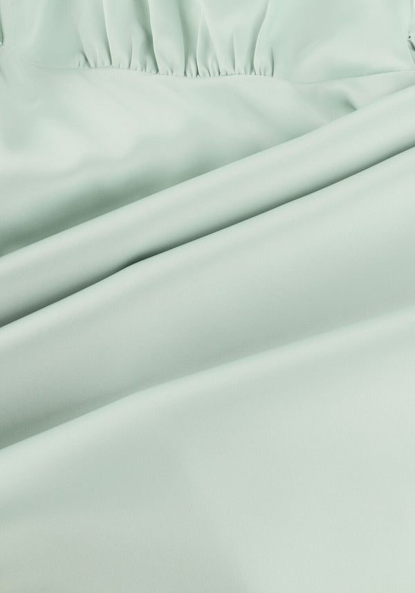 Mint green Elare satin V-neck maxi dress by Pink Baby, shown in a flowing, elegant style with a V-neckline and satin fabric.