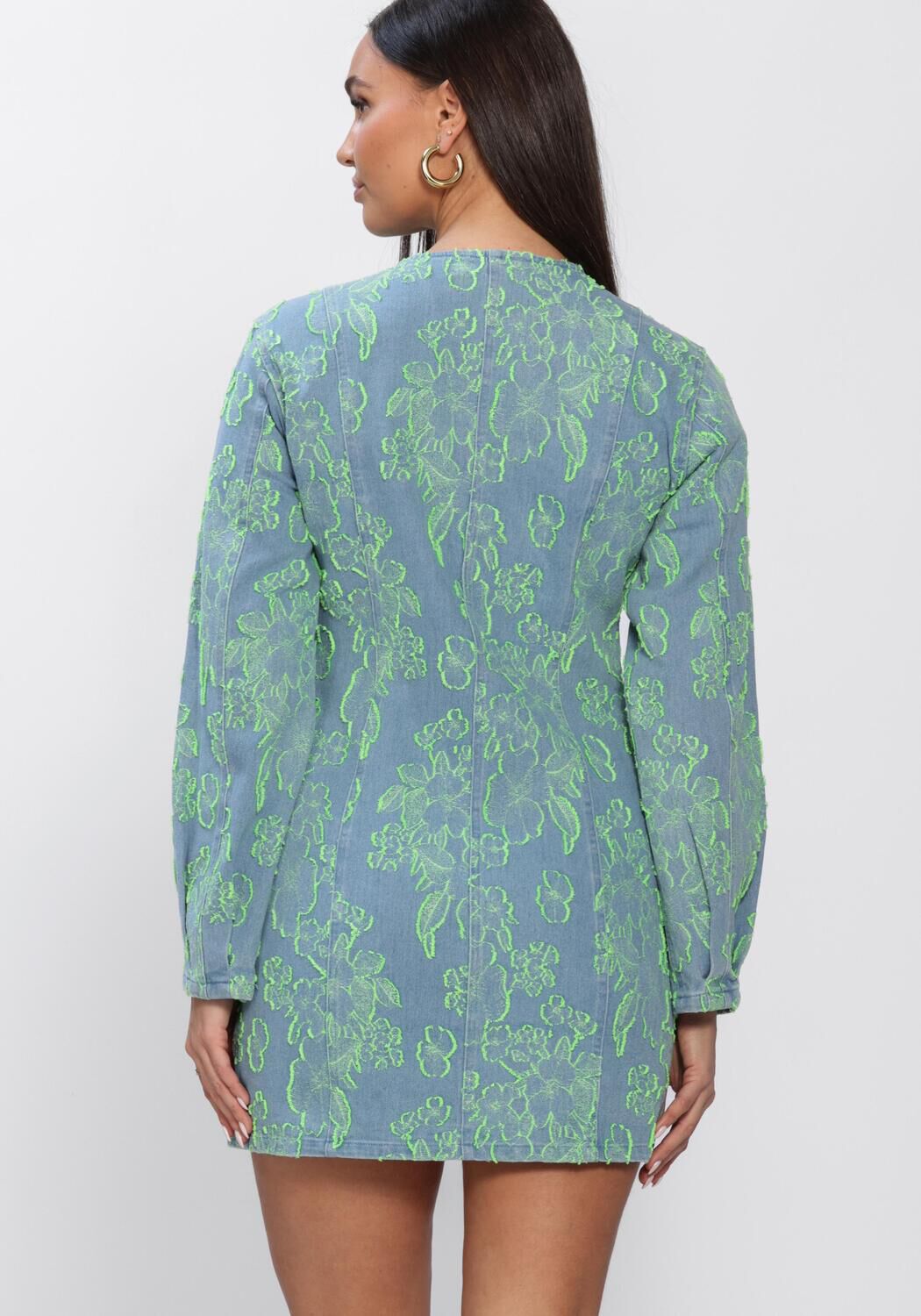 Pink Baby Freya Floral Denim Mini Dress in blue and green with a vibrant floral pattern and casual denim fabric.
