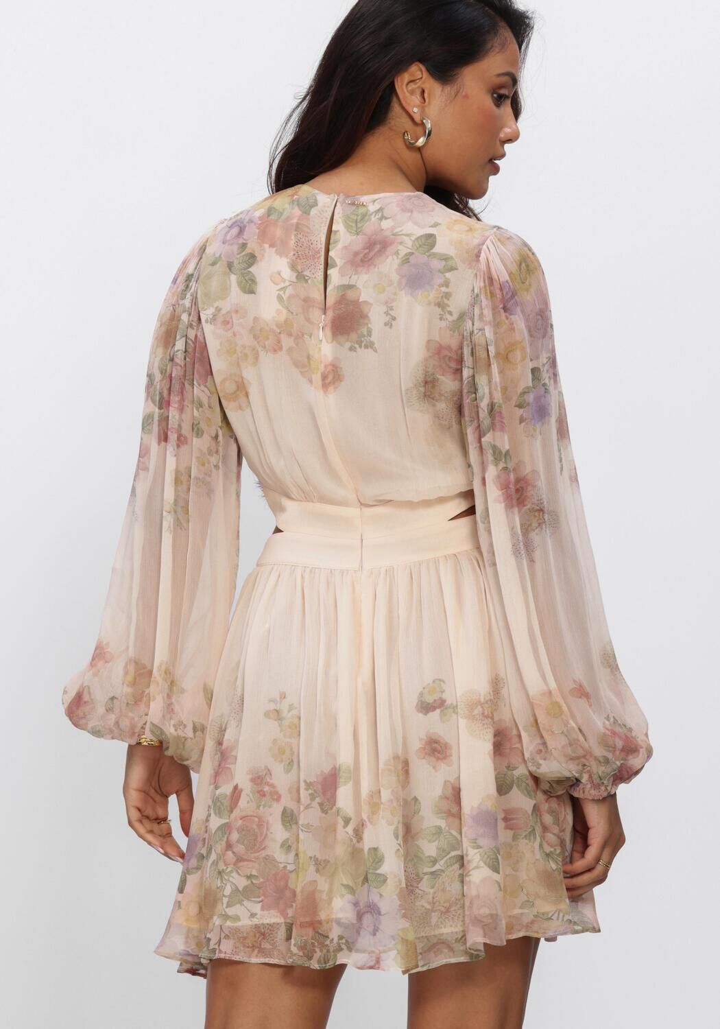 Pink Baby Elodie floral cut-out mini dress in blush ivory, showcasing delicate floral pattern and stylish design.