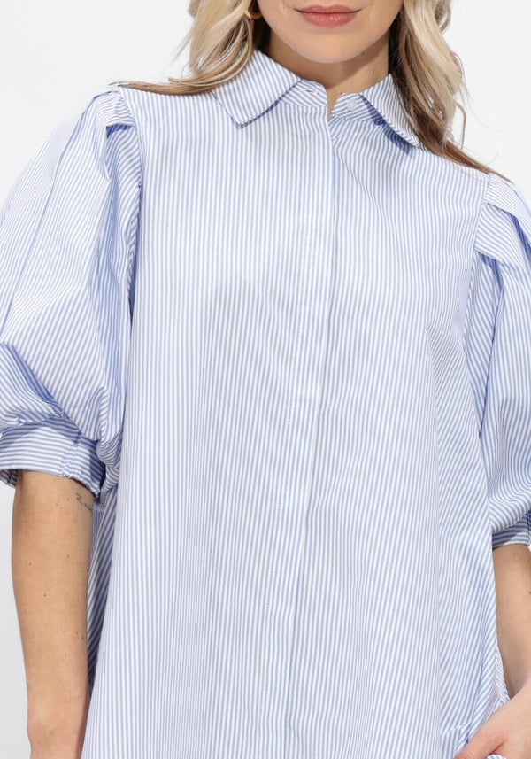 Pink Baby Christine striped puff sleeve shirt dress in blue, showing a casual, stylish dress with puff sleeves and a button-front design.