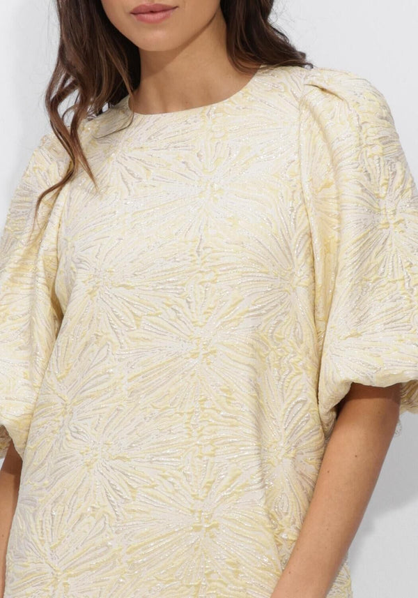 Pink Baby Sabelle textured puff sleeve mini dress in cream fabric, showcasing a stylish and elegant design.