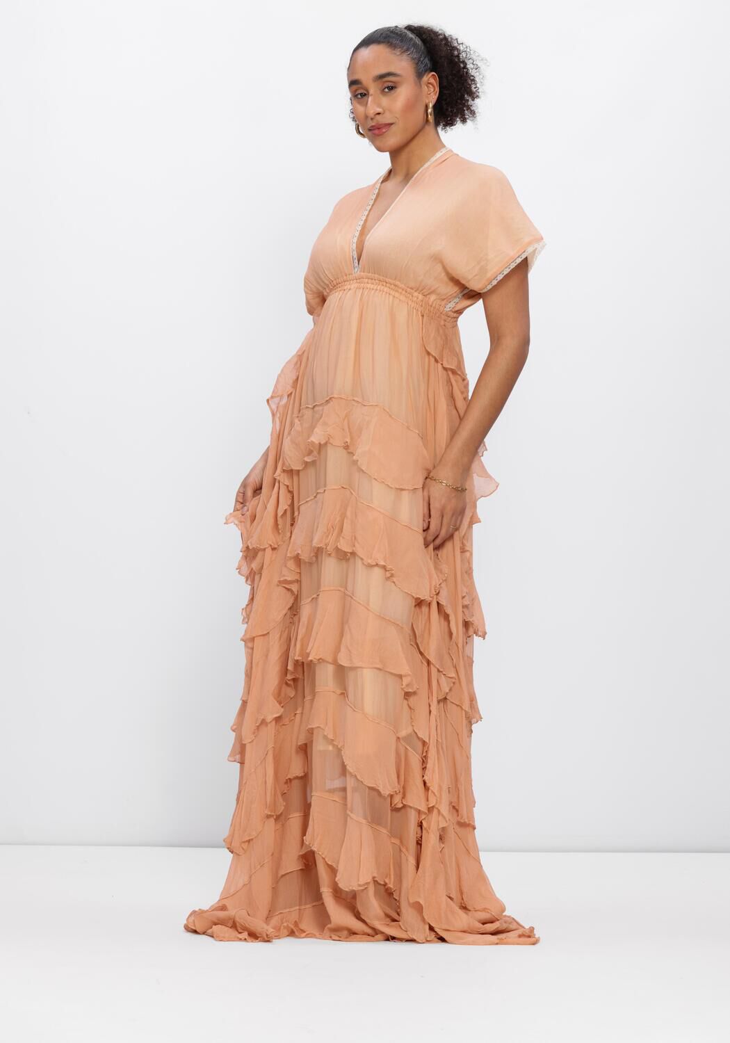 Pink Baby Amara tiered ruffle maxi dress in peach, featuring flowing fabric and layered ruffle details for a stylish look.