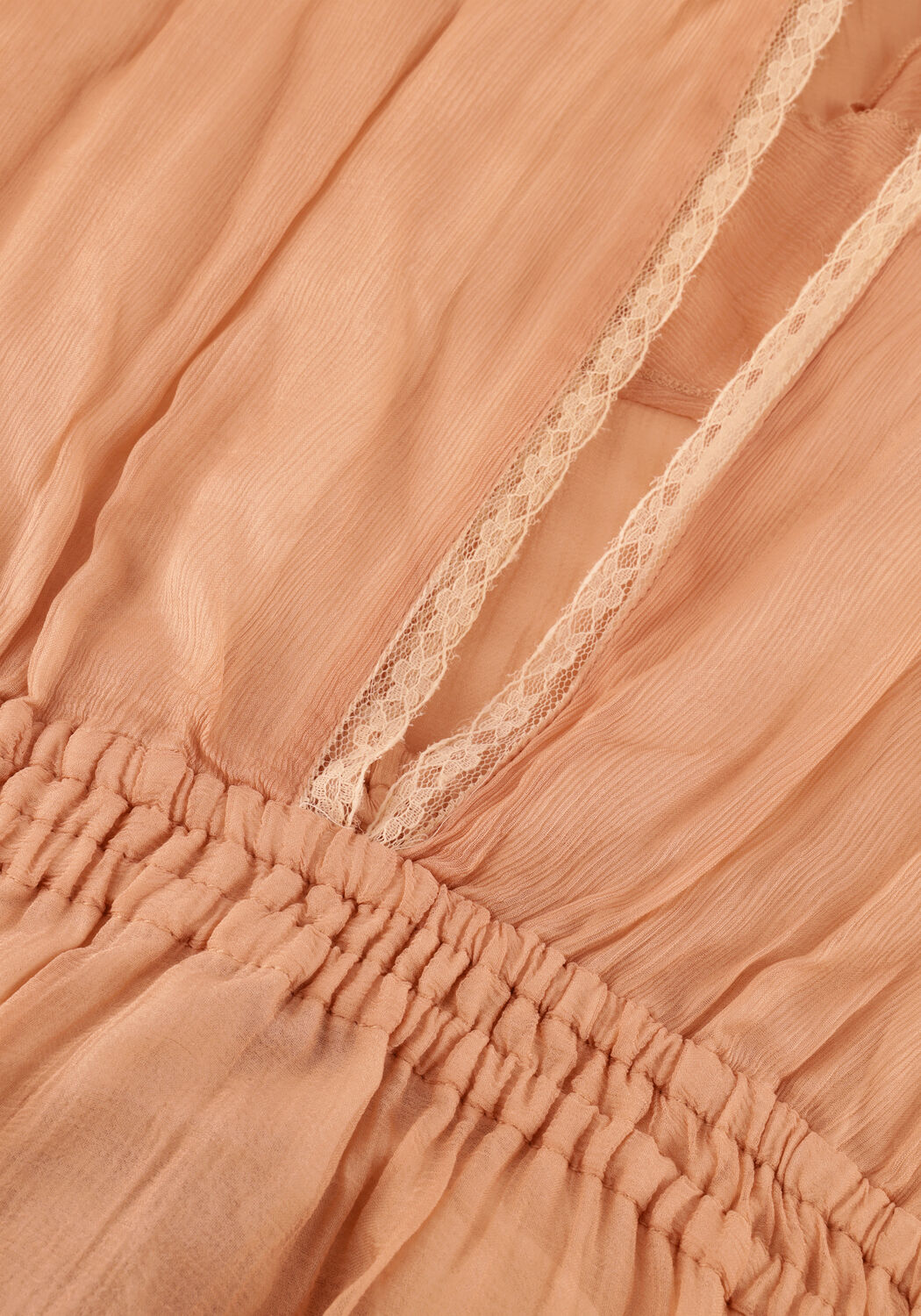 Pink Baby Amara tiered ruffle maxi dress in peach with flowing fabric and layered ruffles, perfect for summer occasions.