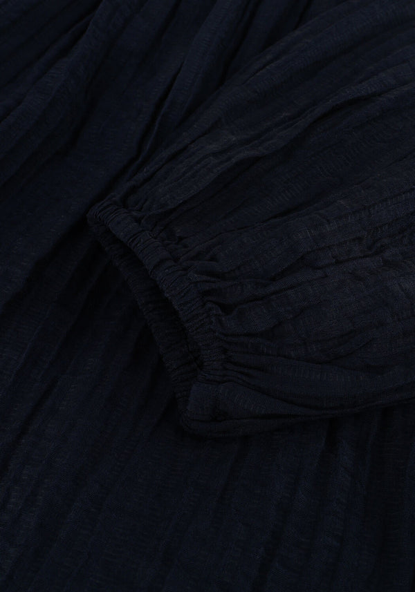 Pink Baby Serena textured V-neck maxi dress in midnight blue, flowing fabric, elegant design, and sleeveless silhouette.