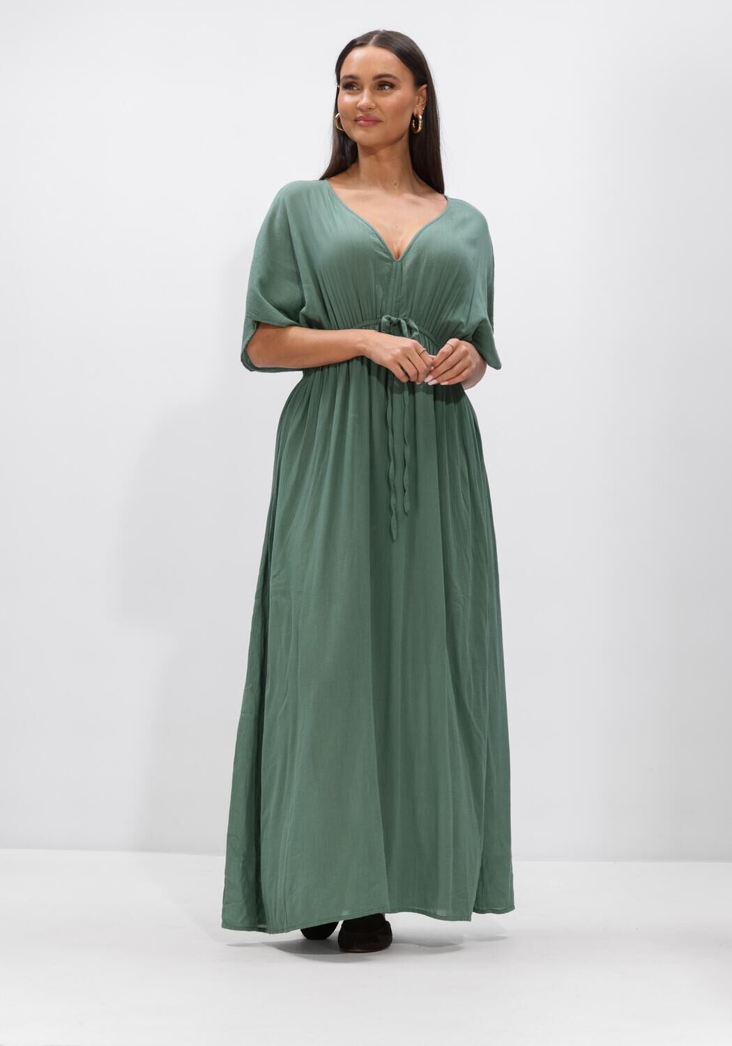 Pink Baby Livia drawstring empire maxi dress in sage green with flowing fabric and elegant design, perfect for casual or formal wear.