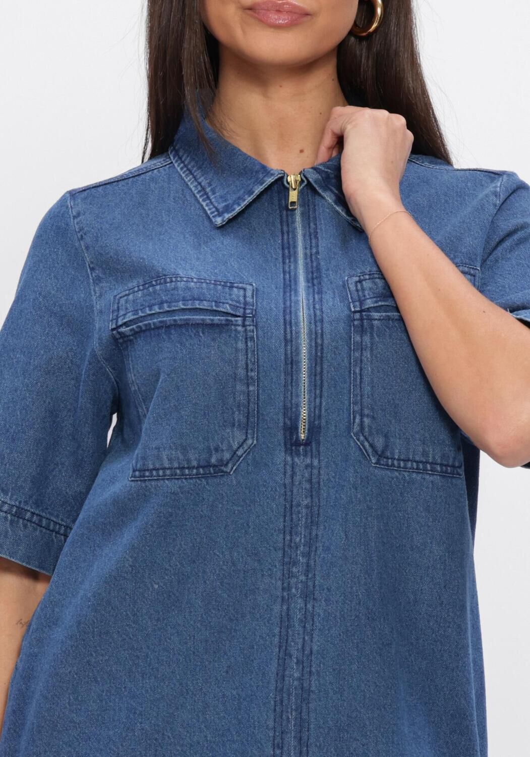 Pink Baby Senie zip-front denim mini dress in mid blue, showcasing a stylish sleeveless design with a front zipper and fitted silhouette.
