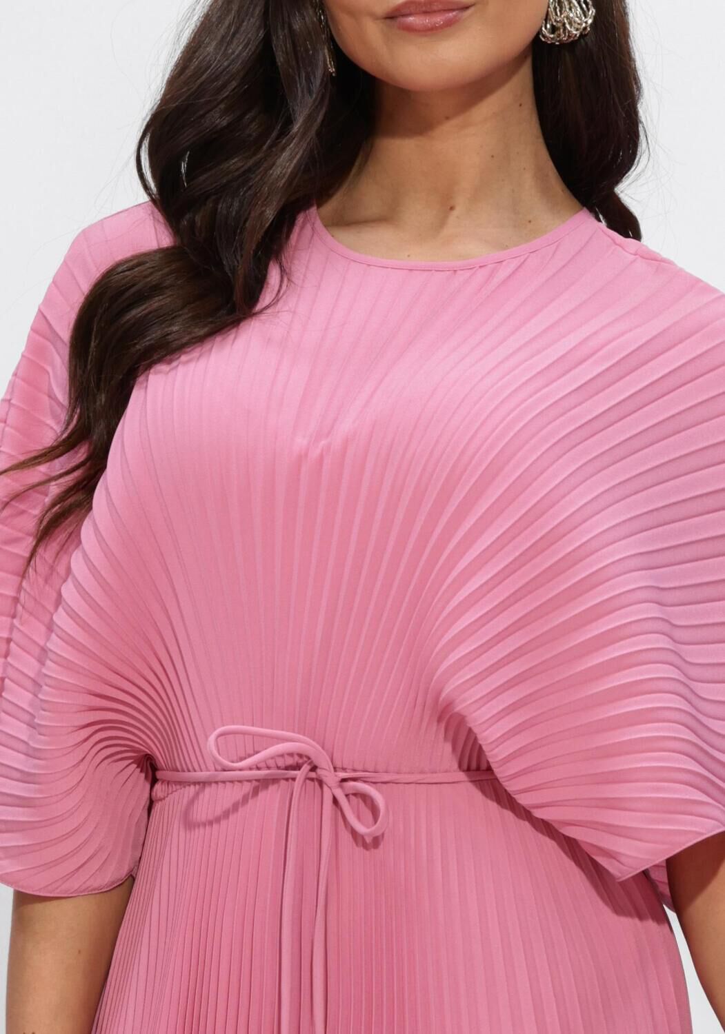 Pink Baby Rosalie pleated cape-sleeve maxi dress in vibrant pink, shown with flowing fabric and elegant design.