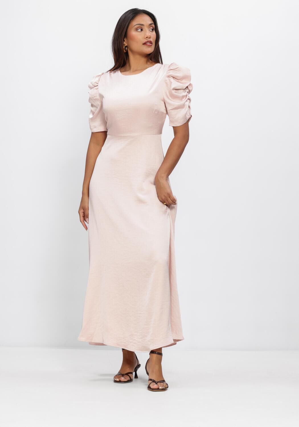 Pink Baby Maxine Satin Puff Sleeve Maxi Dress in blush, featuring elegant puff sleeves and flowing fabric.