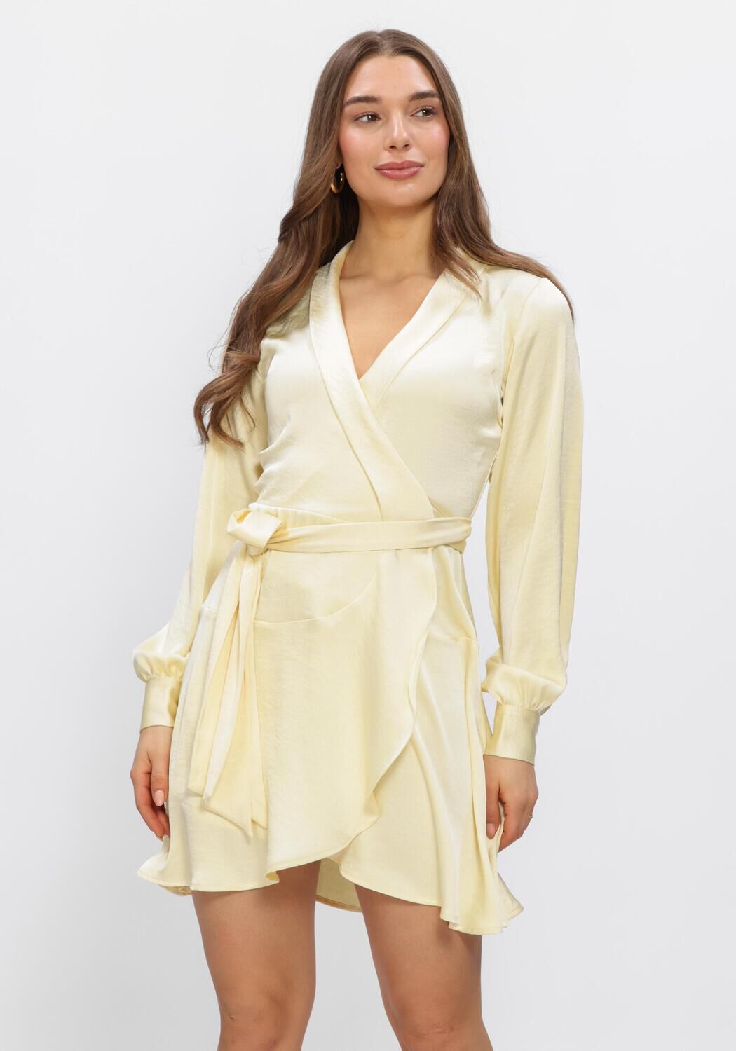 Pink Baby Elissa Satin Wrap Mini Dress in soft vanilla, featuring a stylish satin fabric and a flattering wrap design.