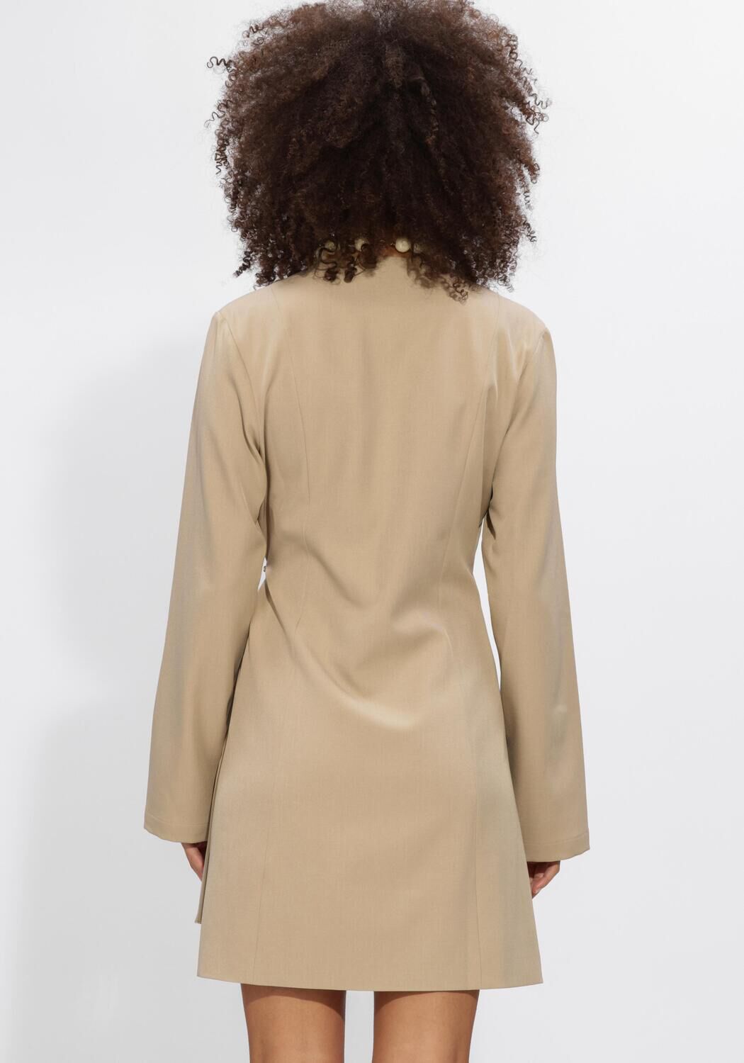Pink Baby beige mini dress with buckle detail, wrap style, perfect for casual or semi-formal occasions.