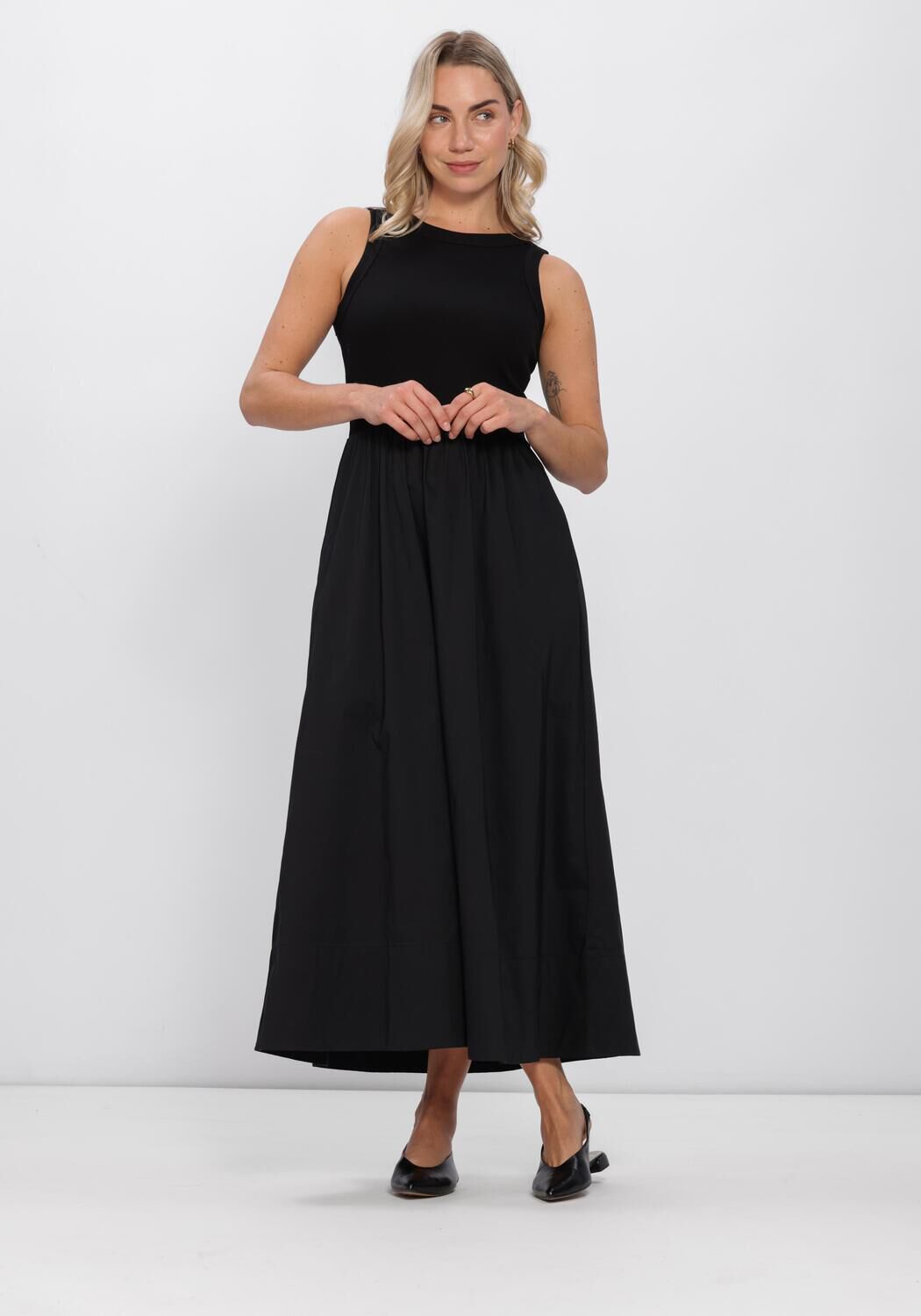 Black Venice sleeveless drop-waist maxi dress by Pink Baby, flowing fabric with a relaxed fit and elegant design.