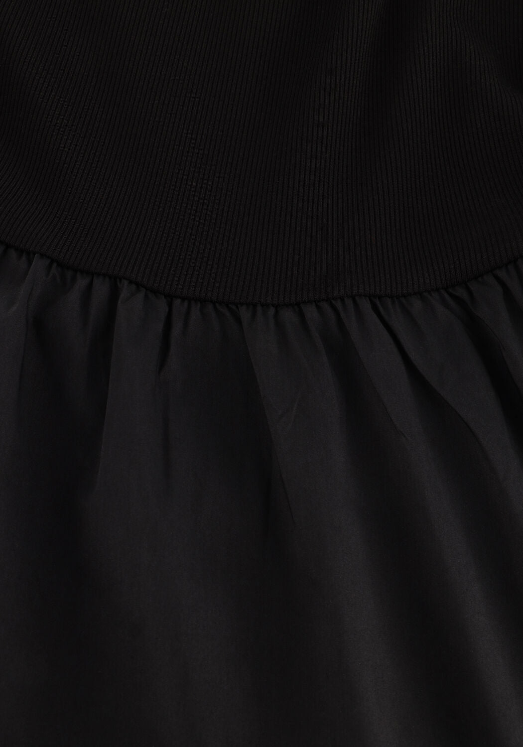 Black Venice sleeveless drop-waist maxi dress by Pink Baby, flowing fabric and elegant design perfect for summer occasions.