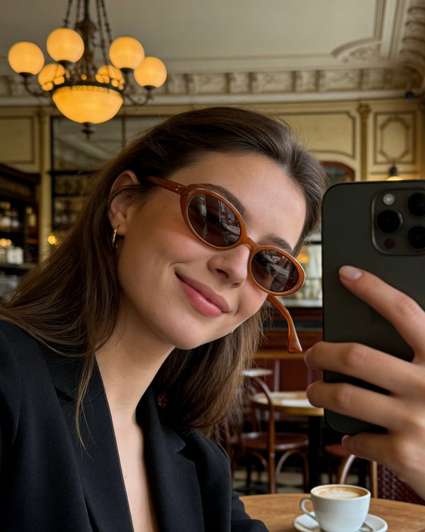 Pink Baby The Kyra pumpkin-shaped sunglasses with orange tinted lenses and playful design, perfect for sunny days.