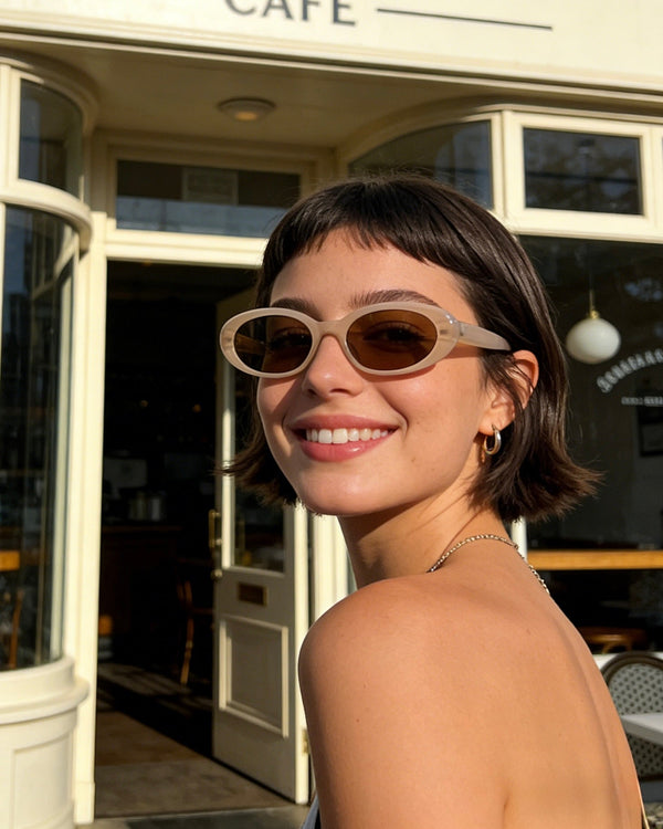 Pink Baby The Kiara cinnamon sunglasses with round brown lenses and a stylish frame, perfect for sunny days.