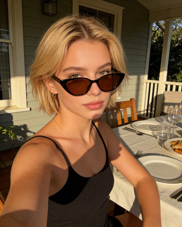 Pink Baby The Juno brown sunglasses with rounded frames and tinted lenses, stylish eyewear for sun protection.