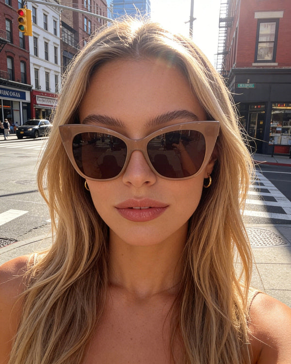 Pink Baby The Rylee cinnamon sunglasses with rounded frames and tinted lenses, stylish eyewear for sun protection.