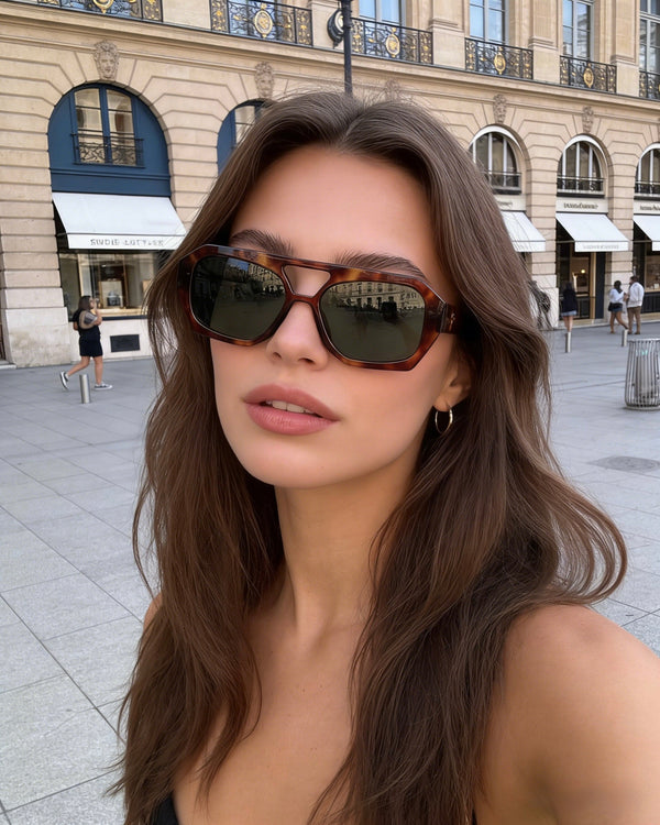 Pink Baby The Navi sunglasses with round tinted lenses and pink frames, stylish eyewear for sun protection.