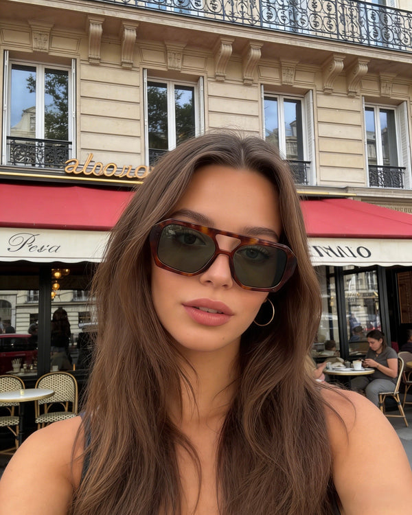 Pink Baby The Navi sunglasses with round frames and tinted lenses, stylish eyewear for a modern, fashionable look.
