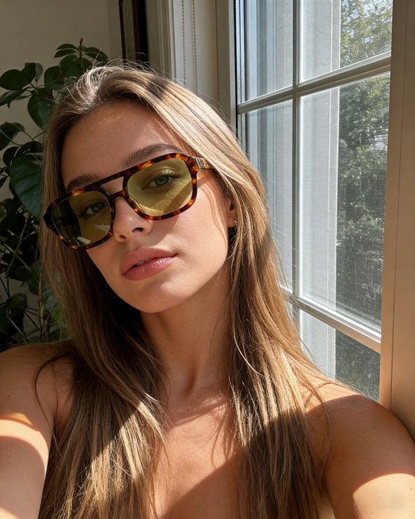 Pink Baby The Olive sunglasses with round tinted lenses and gold accents, stylish eyewear for a modern look.